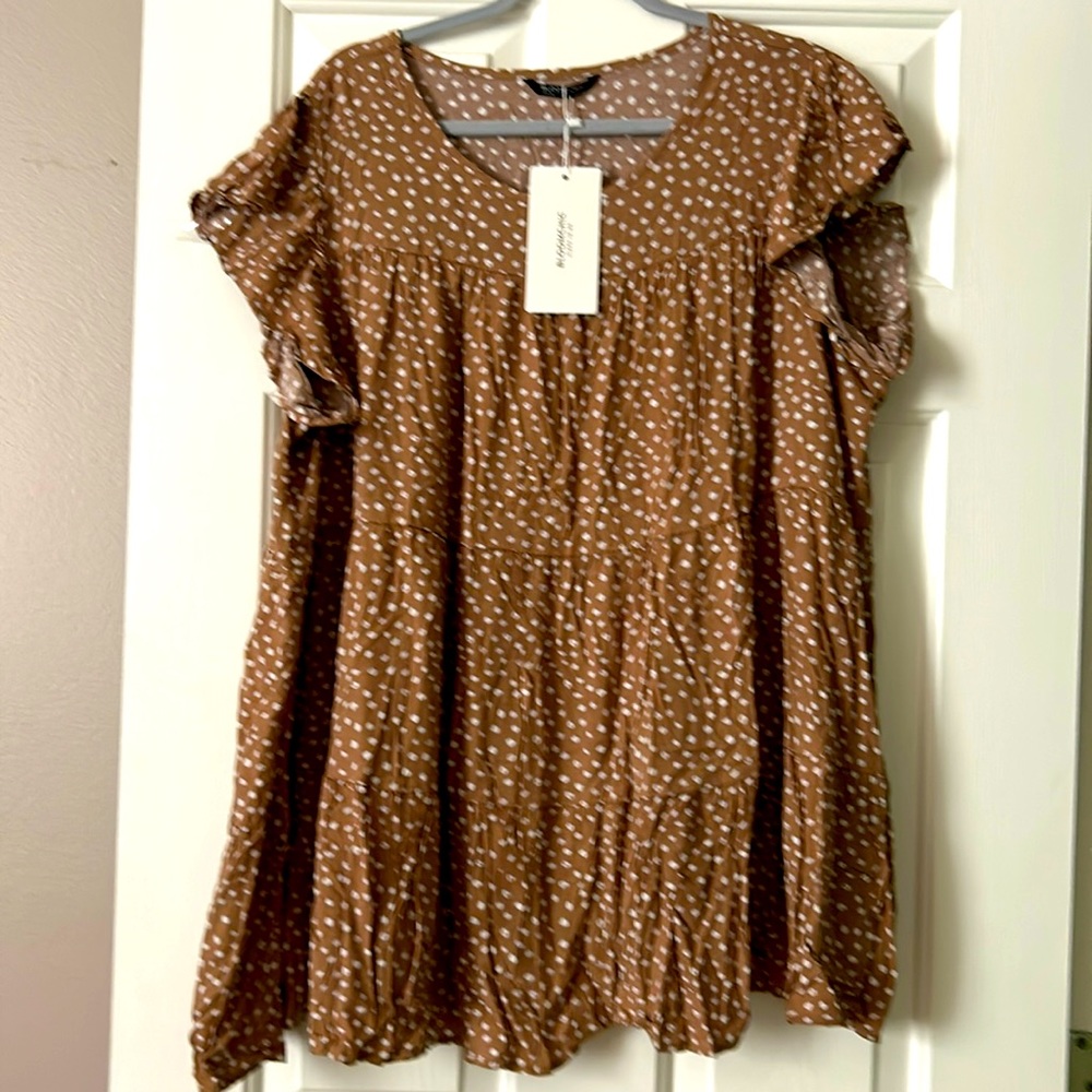 This can be worn a top or a mini dress!!